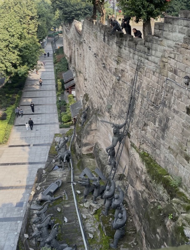 Elias and private guests exploring contrasting daytime and evening Chongqing neighborhoods