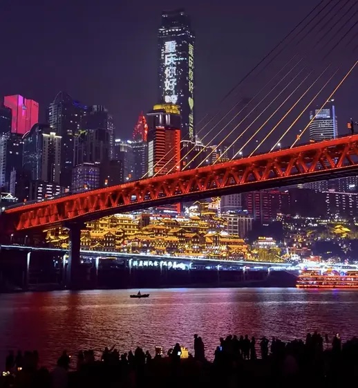 Elias with guests surrounded by recognizable neon Chongqing streets at night