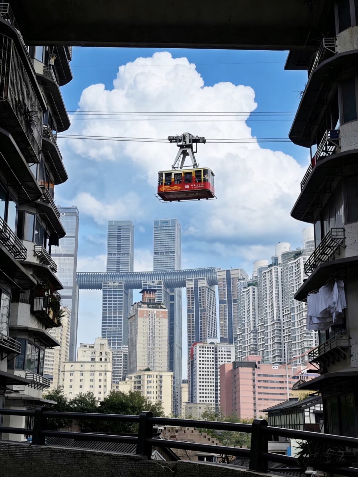 A cable car crossing the river with Chongqing's layered skyline beyond
