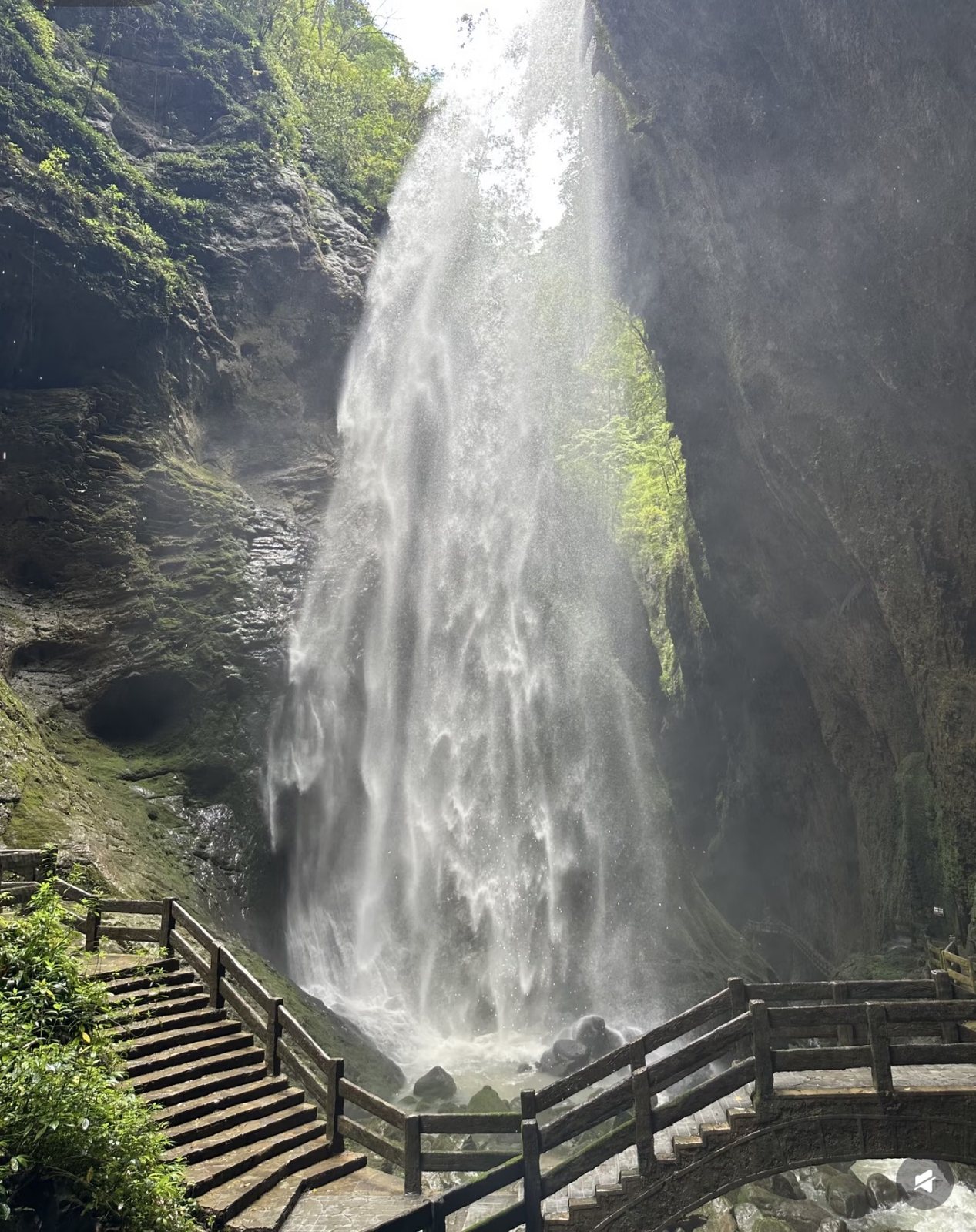 A waterfall descending into the narrow Longshuixia Fissure gorge